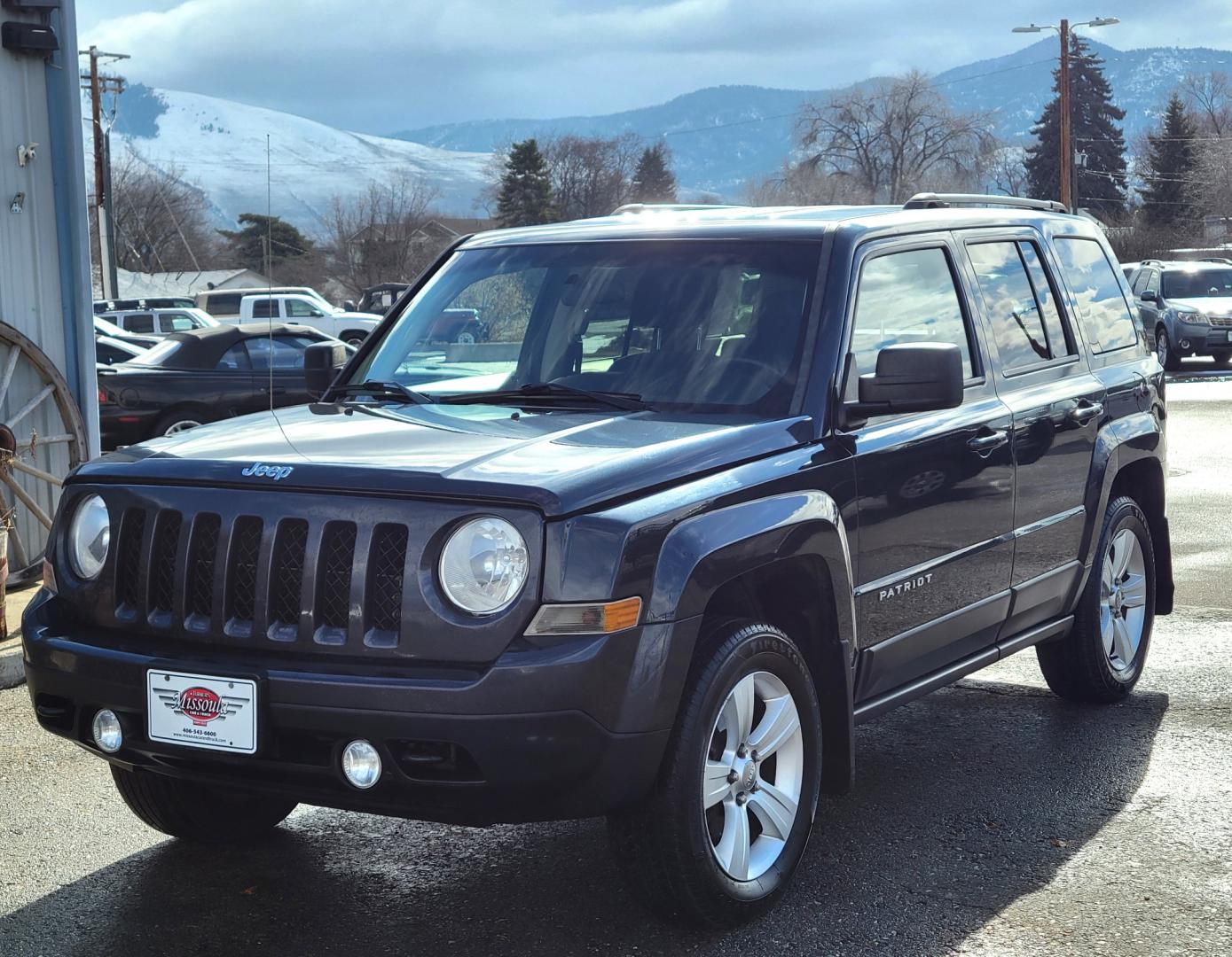 2014 Blue /Black Jeep Patriot Latittude (1C4NJRFB7ED) with an 2.4L I4 engine, 6 Speed Automatic transmission, located at 450 N Russell, Missoula, MT, 59801, (406) 543-6600, 46.874496, -114.017433 - Photo#1